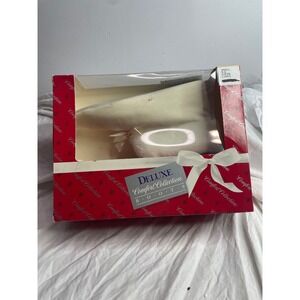 pair of Deluxe Comfort Collection Boots in a champagne color.